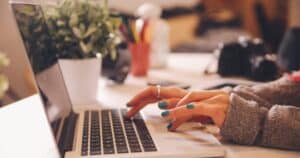 woman typing on computer