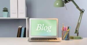 Computer on desk with blog written on screen