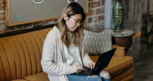 woman on laptop doing DIY Website Audit