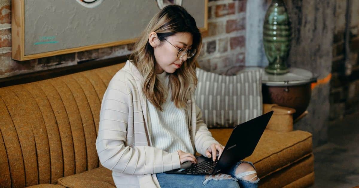 woman on laptop doing DIY Website Audit