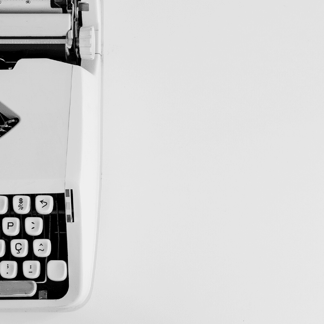 typewriter on white background representing doula website copy